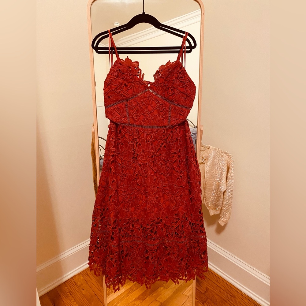 Red lace A-line midi dress by Free People. Size 12.